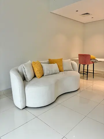 Stylish Curved Sofa with Cushions