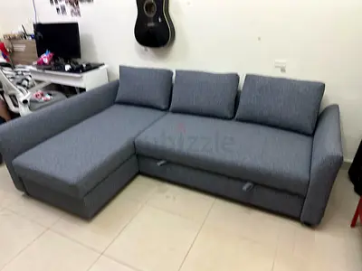 Beautiful Grey Fabric Sofa Bed with chaise lounge. Easy to convert into a bed with large storage spa