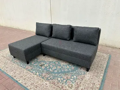 Grey L-Shape Sofa Bed with storage space. Modern design, very comfortable seating, and easily conver