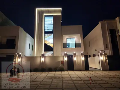 For sale, a villa in Ajman Al Helio, 6 master rooms, a Majles room, a hall, and a maid’s room, freehold for all nationalities