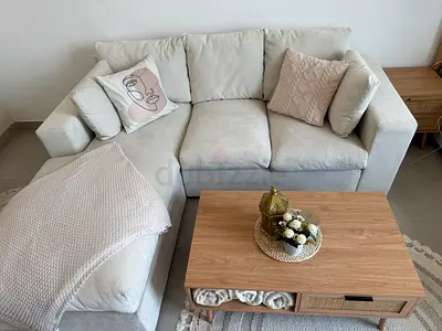 Comfortable Beige L-Shaped Sofa with Coffee Table