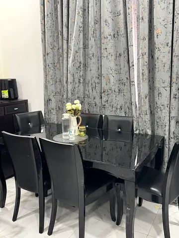 Elegant Dining Table Set with Stylish Black Chairs