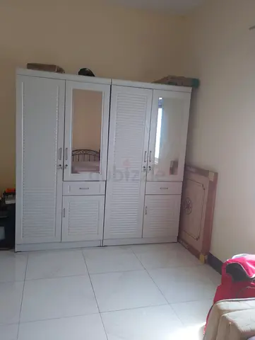Stylish White Wardrobe with Mirrors and Ample Storage