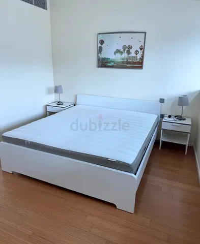 Minimalist White Bed with Nightstands