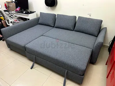 Modern L-Shape Grey Sofa Bed. Soft cushions, strong frame, and hidden storage under the seat.