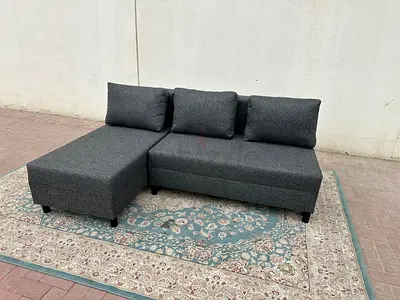 Premium Grey L-Shape Sofa Bed. Durable material, modern design, and extra storage for blankets or pi