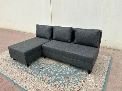 Stylish Grey Fabric Sofa Bed. Strong frame, soft cushions, and large storage box under the seat for