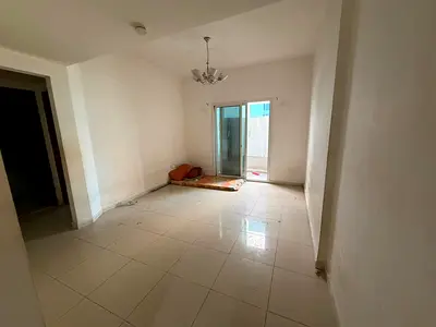 The cheapest 1BR + living room in Al Taawun, balcony with open view, central AC, prime location near all services, easy access to Dubai exit.