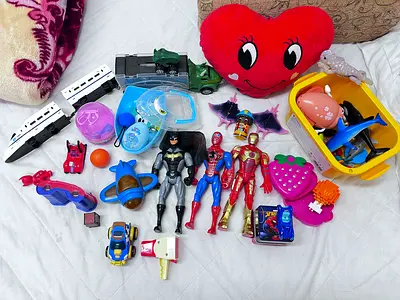 Assorted Toy Collection Including Action Figures and Vehicles