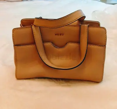 Genuine DKNY bag - authenticated by The Luxury Closet