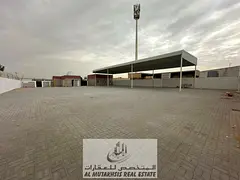 land for rent 14,000 sqft in Sajaa with a 77 kW electricity The plot is situated on a main road, 97