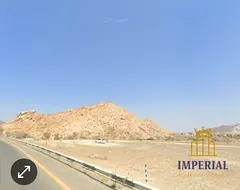 🔥 Prime investment in Masfout, Ajman! Single plot for sale, 3,013 sq ft on a main street with res
