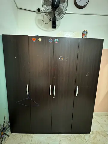 Wooden Wardrobe with Three Doors And sofa