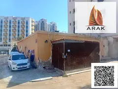 A traditional Arabic house is available for sale in Al Rashidiya 3, Ajman, located behind Grand Mall