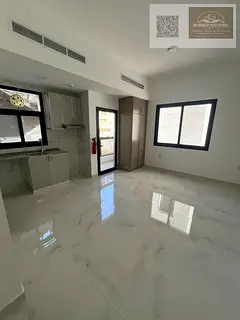 Brand new **studio (first tenant)** with balcony, built-in wardrobes, and central AC for rent in Al