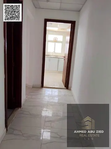 Two bedrooms and a living room for annual rent in Ajman, Emirates City | Master bedroom + living room | Balcony with an open view of Sheikh Mohammed B