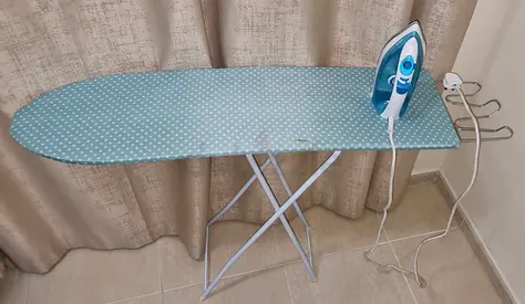 Ironing board with iron for sale