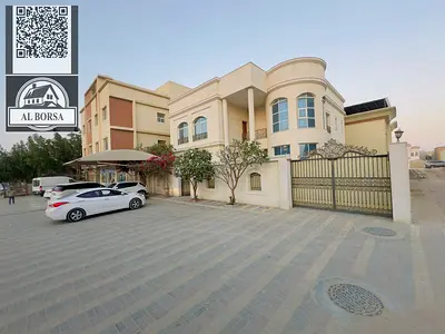 For rent in Rawda 1, a furnished villa with 5 master bedrooms, a majlis, two living rooms, a spacious kitchen, and a maid's room.