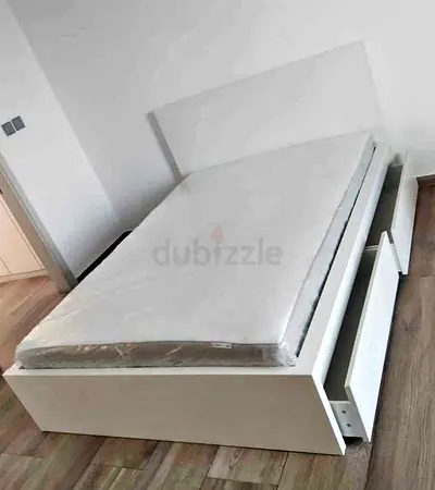 IKEA malam double‑size bed (140 × 200 cm) with 2 storage drawers underneath and an IKEA mattress