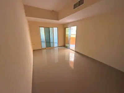 Two-Bedroom Apartment for Annual Rent in Al Jurf 2 Ajman Opposite Al Rawdha Bridge Prime Location Full Maintenance Balcony Overlooking Main Road