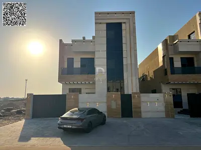 Luxury 6-bedroom villa for sale in Al Helio 2, Ajman, featuring a modern design and spacious living areas.