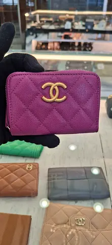 Elegant Purple Wallet with Iconic Logo