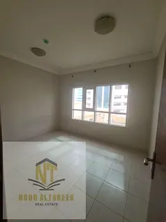 Al Majaz 1, two rooms, a living room, and two bathrooms, without administrative fees and a Mogul che