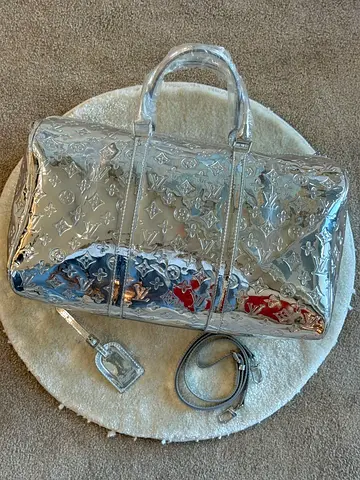 LV silver travel bag