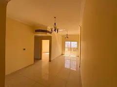 For annual rent: Two bedrooms, living room, 2 bathrooms, balcony, Al Na'amiyah 1, swimming pool,