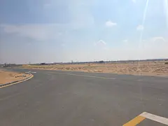 Commercial corner plot for sale in Al Sahma area, on the main road in Al Ruwaidat suburb, Sharjah.