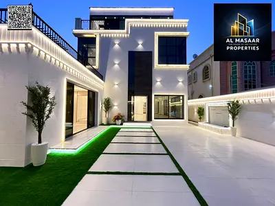 Villa for sale in Rawda 3. The villa has 3 floors with an external annex, 5 master bedrooms, 3 living rooms and a majlis, 3 kitchens, and central air