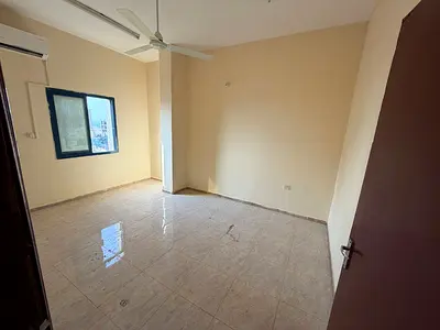 2BR + hall near Ajman Corniche, 2 baths, balcony, bright apartment. Rent AED 35,000 yearly in 6 payments, deposit AED 2,000.
