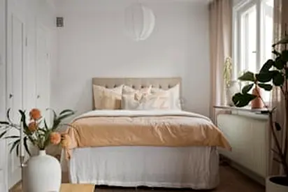 Elegant Bed with Soft Bedding and Modern Decor
