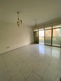 Two rooms and a hall in Abu Shagara with excellent space and high-end finishes with a balcony and 2