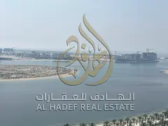 Stunning views in Al Qasba ✨ | Free air conditioning and parking | One bedroom and living room wit