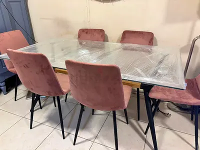 Modern Glass Dining Table with Pink Velvet Chairs