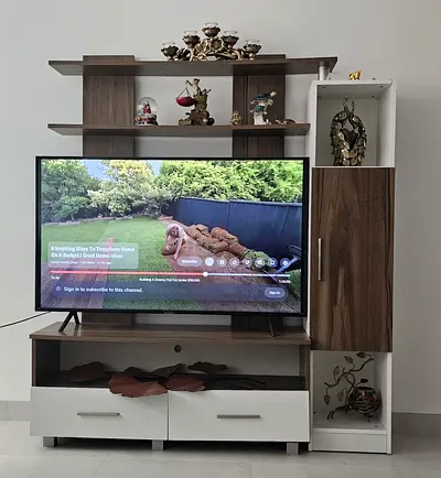 Compact Entertainment Center with TV and Stylish Wall Unit with storage