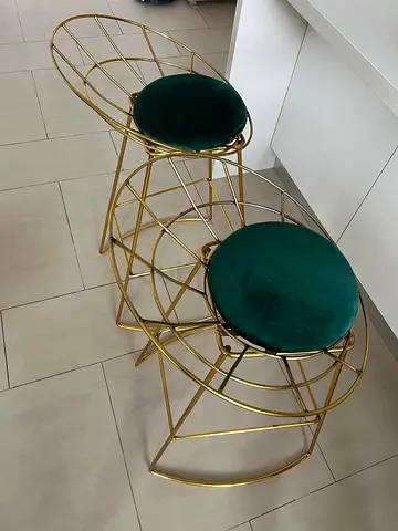 Two elegant bar stools with a refined look