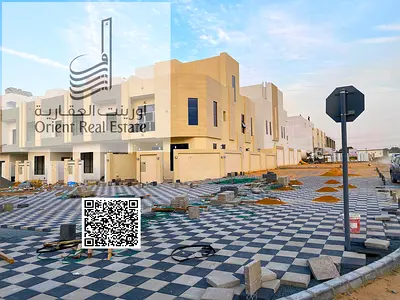 Corner villa with setback for sale in Ajman, Al Helio 2 area. The villa consists of 4 master bedrooms, a majlis, a living room, a maid's room, and a r