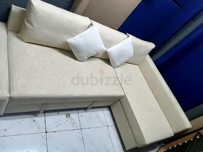 L-Shaped Beige Sofa with Cushions