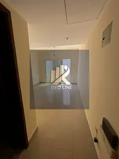 Two-bedroom apartment with a living room for rent in the Abu Shaghara area. The building is reserved