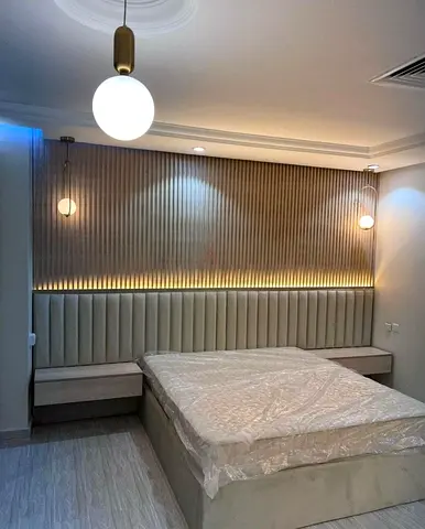 Custom MDF Floating Platform Bed with LED Lighting and Slatted Wall Panel