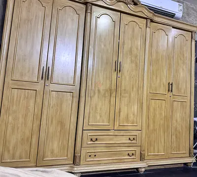 Elegant Wooden Wardrobe with Detailed Carvings