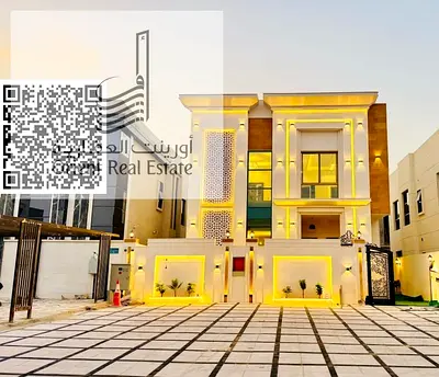 For sale in Ajman, Al Zahia area, including registration and ownership fees, 5 master bedrooms, a majlis, a hall, a modern kitchen, and a maid's room