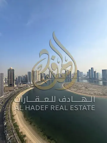 Two-bedroom apartment with a living room and balcony in Al Khan, near Al Khan Corniche – spacious with a gym, swimming pool, free parking, and air con