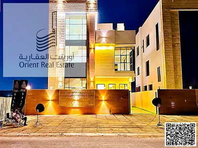 Villa for sale in Ajman, Al Helio 2 area, with a swimming pool, including registration and ownership fees, consisting of 6 master bedrooms with a majl