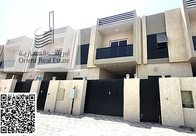 Townhouse for sale in Ajman, Al Helio 2 area. The townhouse consists of a ground floor + roof, 3 master bedrooms, a living room, a large kitchen, a fi