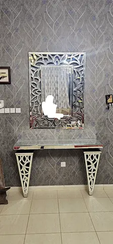 Dinning table plus a mirror and a table