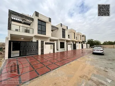 Corner villa for sale in Ajman, Al Yasmeen area. Includes registration fees. 5 master bedrooms, majlis, living room, and maid's room. Freehold ownersh