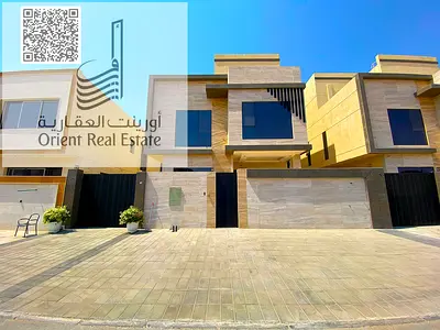 Villa for sale in Ajman, Al Yasmeen area, including registration fees, consisting of 5 bedrooms, a majlis, 2 halls, a large kitchen, a fitted kitchen,